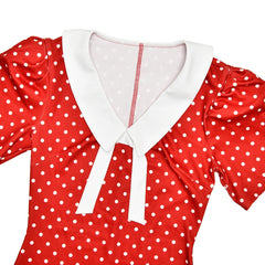 Red polka dot dress with white collar on a white background