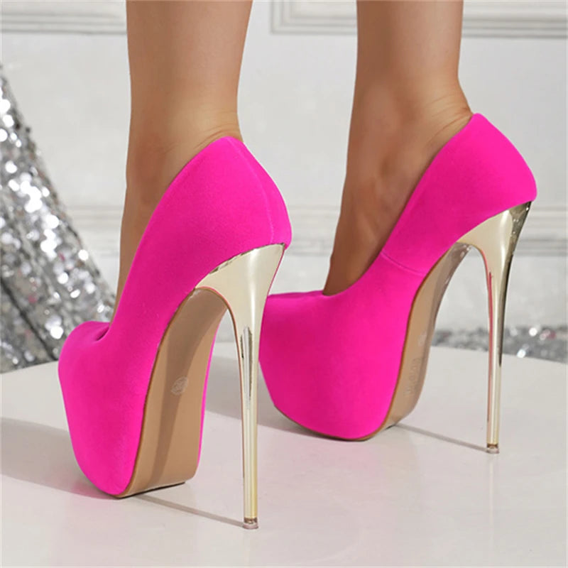 Hot pink high-heeled shoes on a neutral background