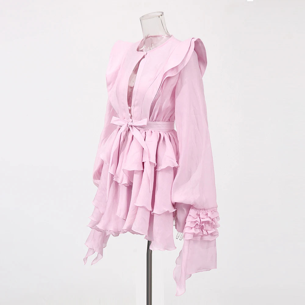 Pink dress on a mannequin against a white background