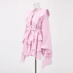 Pink dress on a mannequin against a white background