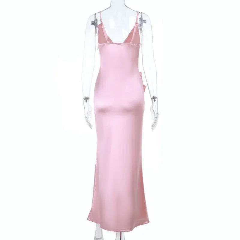 Pink satin slip dress on a mannequin against a white background