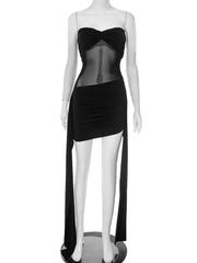 Mannequin wearing a black dress with sheer overlay on a white background
