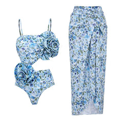 Floral print one-piece swimsuit with floral appliques and matching wrap skirt