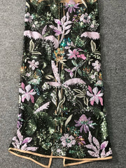 Embroidered fabric with floral pattern on a dark background