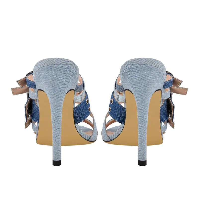 Back view of denim stiletto sandals with tan sole