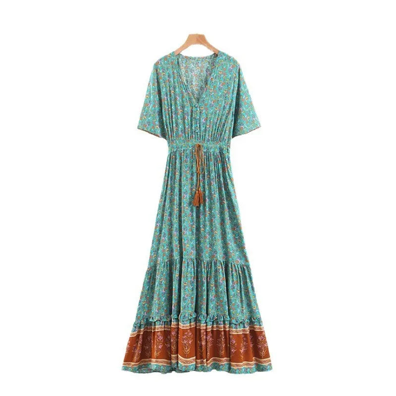 Bohemian floral print V-neck maxi dress hanging on a hanger