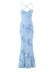 Light blue floral dress with thin straps on a white background