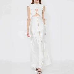 White sleeveless dress with cut-out design on a white background
