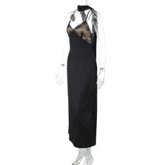 Black evening gown with lace detailing on a mannequin against a white background