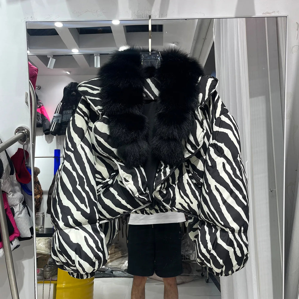 Zebra print puffer jacket with black fur collar