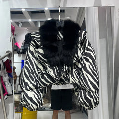 Zebra print puffer jacket with black fur collar
