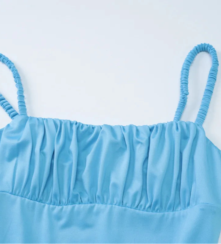 Light blue strapless top on a light gray background