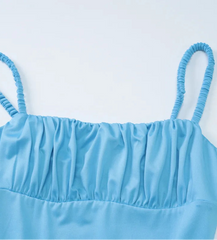 Light blue strapless top on a light gray background