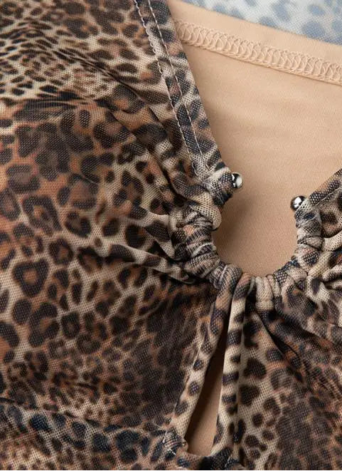 Leopard print fabric with a close-up of the texture and pattern.