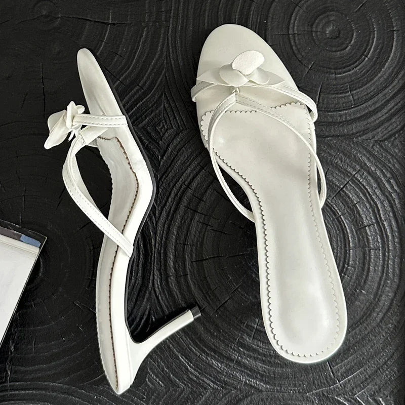 White flower embellished thin heel mules