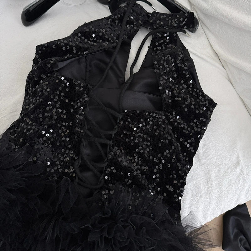 Back view of the sequin dress showing lace-up closure