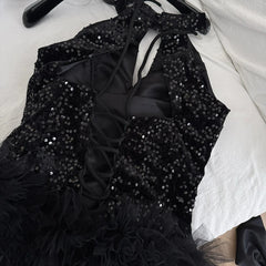 Back view of the sequin dress showing lace-up closure