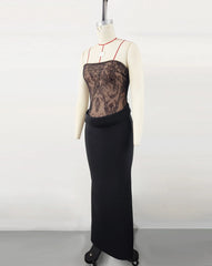 Black lace evening gown on a mannequin against a white background