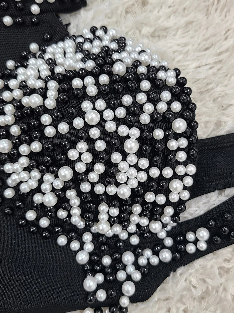 Black and white beaded belt on a textured surface