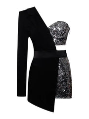 Black one-shoulder dress with silver sequin accents on a white background