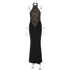 Black evening gown with gold embellishments on a mannequin against a white background