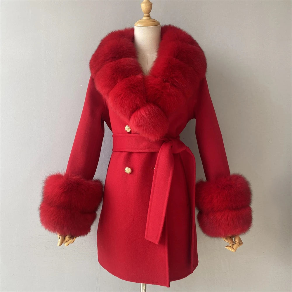 Red coat with fur trim on a mannequin against a plain background