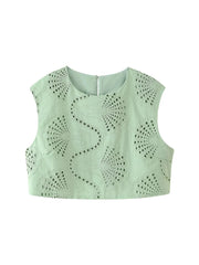 Light green sleeveless top with cut-out design on a white background