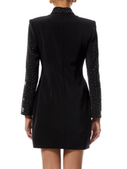 Black dress with embellished sleeves on a white background