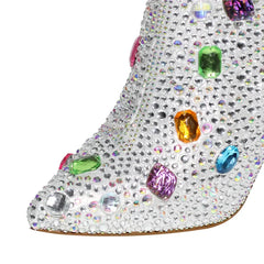 Close-up of rhinestone and gemstone embellishments on a pointed toe boot