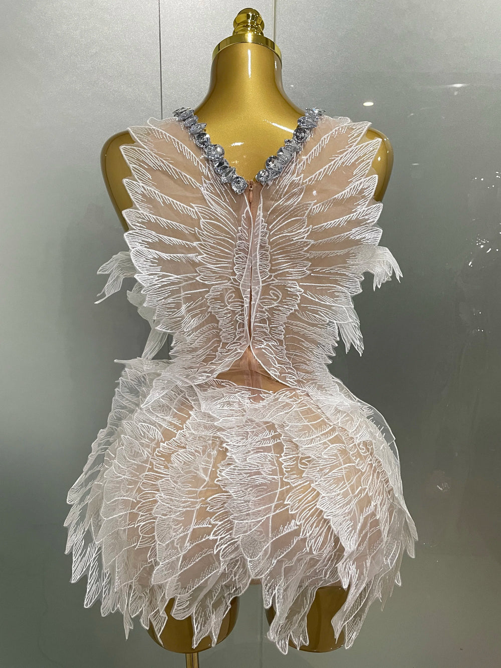 Back view of white crystal wing mini dress