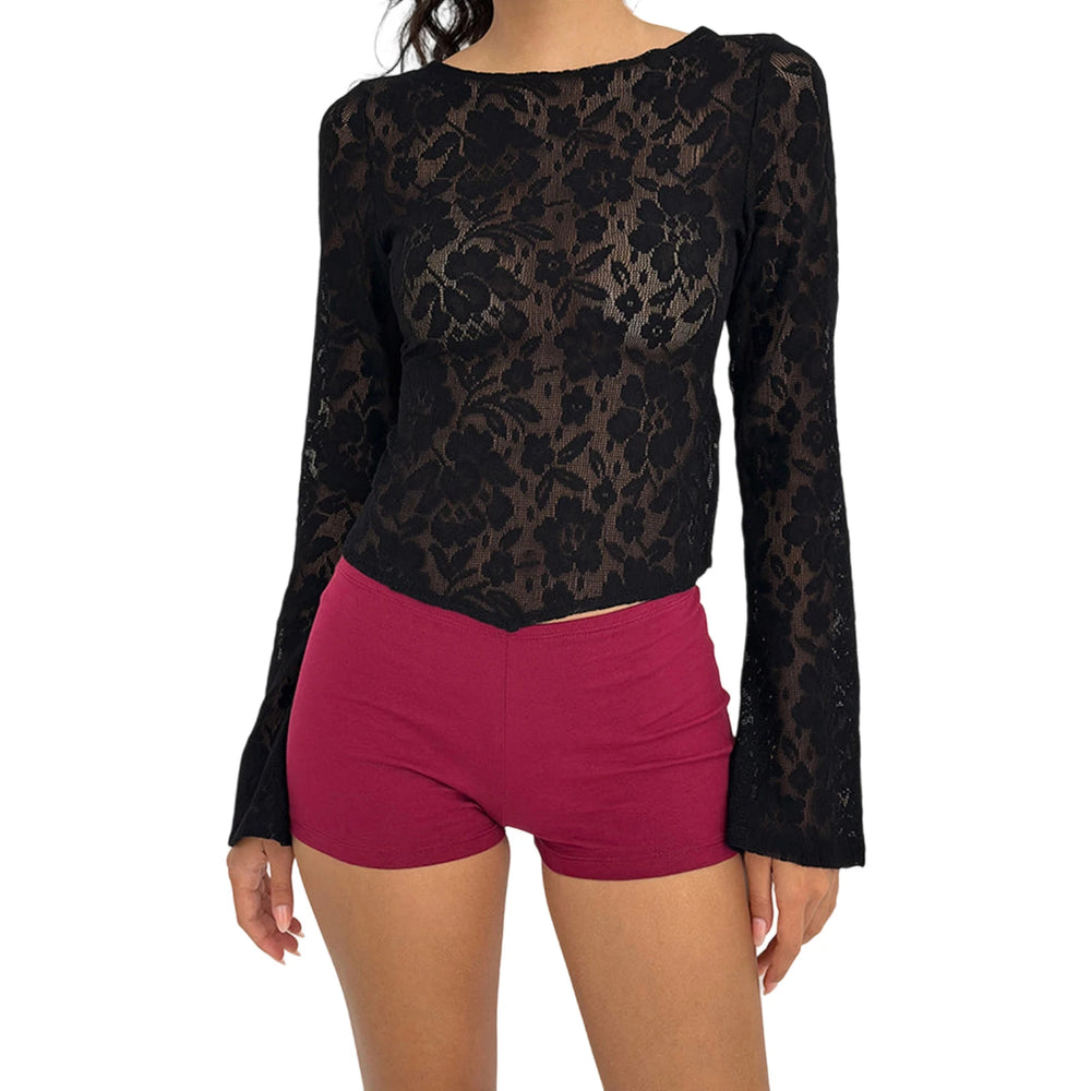 Black lace long-sleeve top and pink shorts on a white background