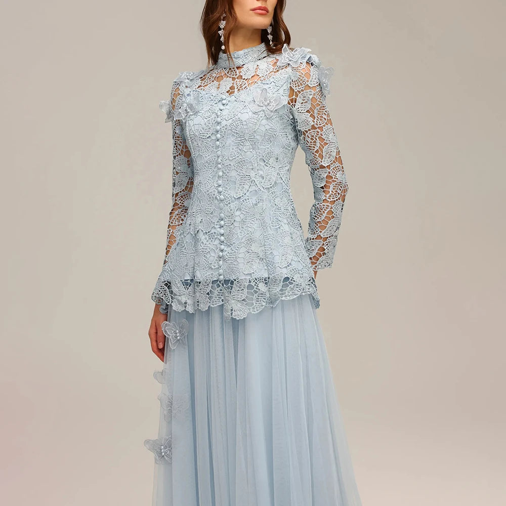 Light blue lace dress on a plain background