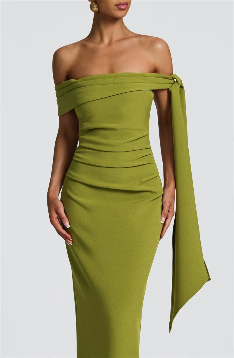 Green strapless dress with a draped design