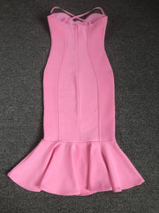 Pink dress with a fitted bodice and flared skirt on a dark gray background