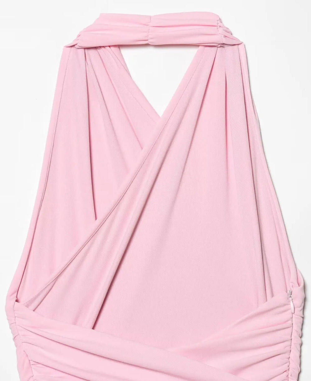 Pink halter top on a light gray background