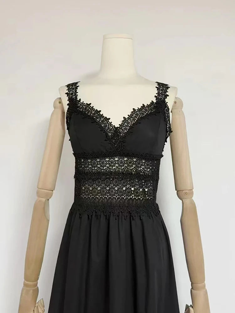 Black lace dress on a mannequin against a white background