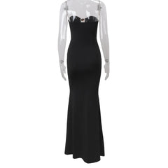 Black evening gown on a transparent mannequin against a white background