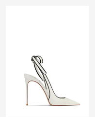 White high-heeled shoe with a clear strap on a white background