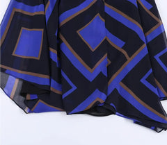Close-up of geometric print on asymmetrical chiffon midi skirt