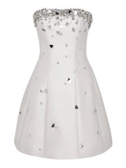 White strapless dress with crystal embellishments on a white background