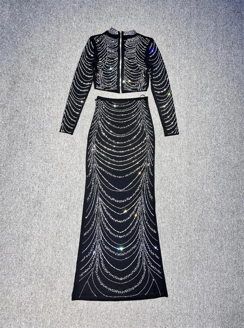 Black beaded two-piece outfit on a gray background