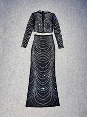 Black beaded two-piece outfit on a gray background