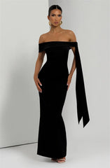 Woman wearing a black off-shoulder gown
