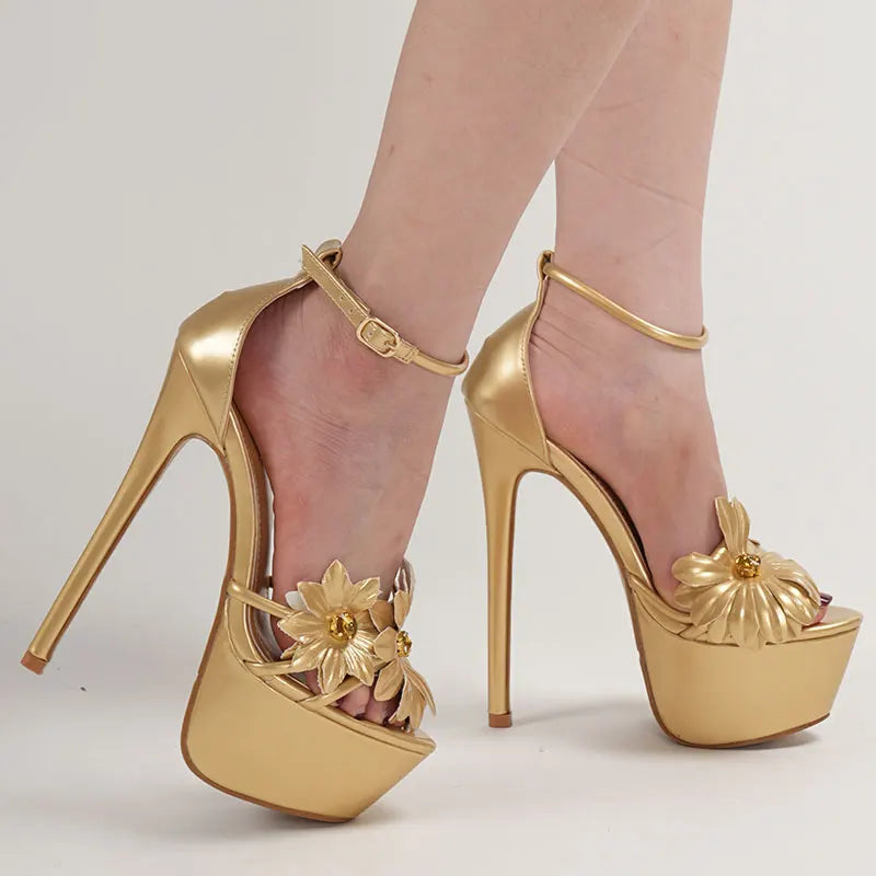 Gold high-heeled shoes with floral designs