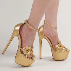 Gold high-heeled shoes with floral designs