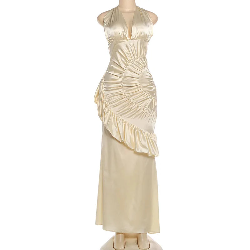 Beige evening gown on a mannequin against a white background