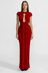 Red evening gown with cut-out design on a white background