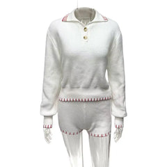 White outfit with red trim on a white background