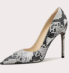 High-heeled shoe with snake print pattern on a light gray background
