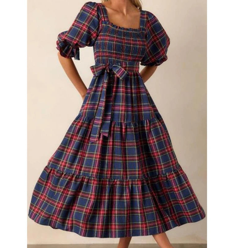 Plaid dress with puff sleeves on a plain background